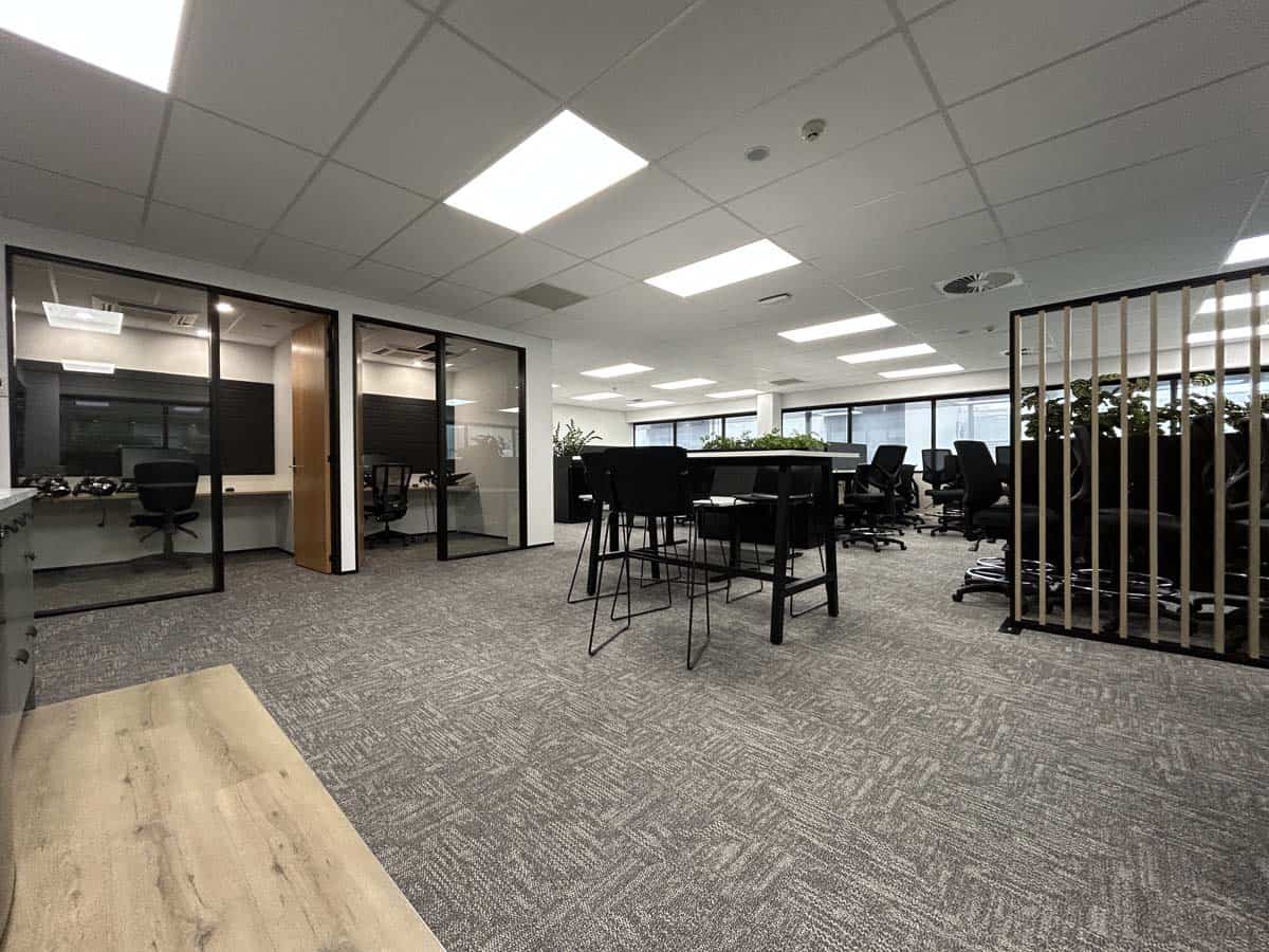 White Lion modern office with meeting area, workstations, and natural light.