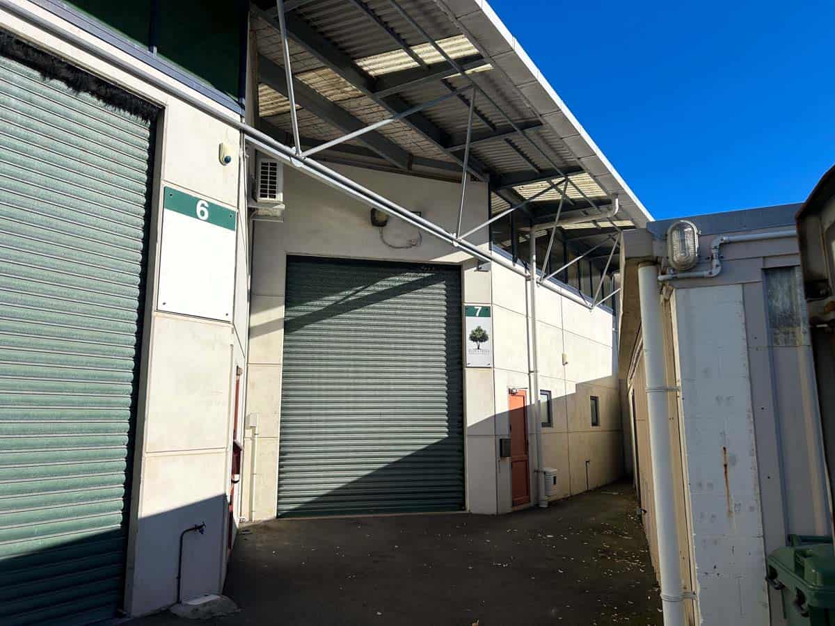 Industrial warehouse with roller door and loading dock in Auckland.