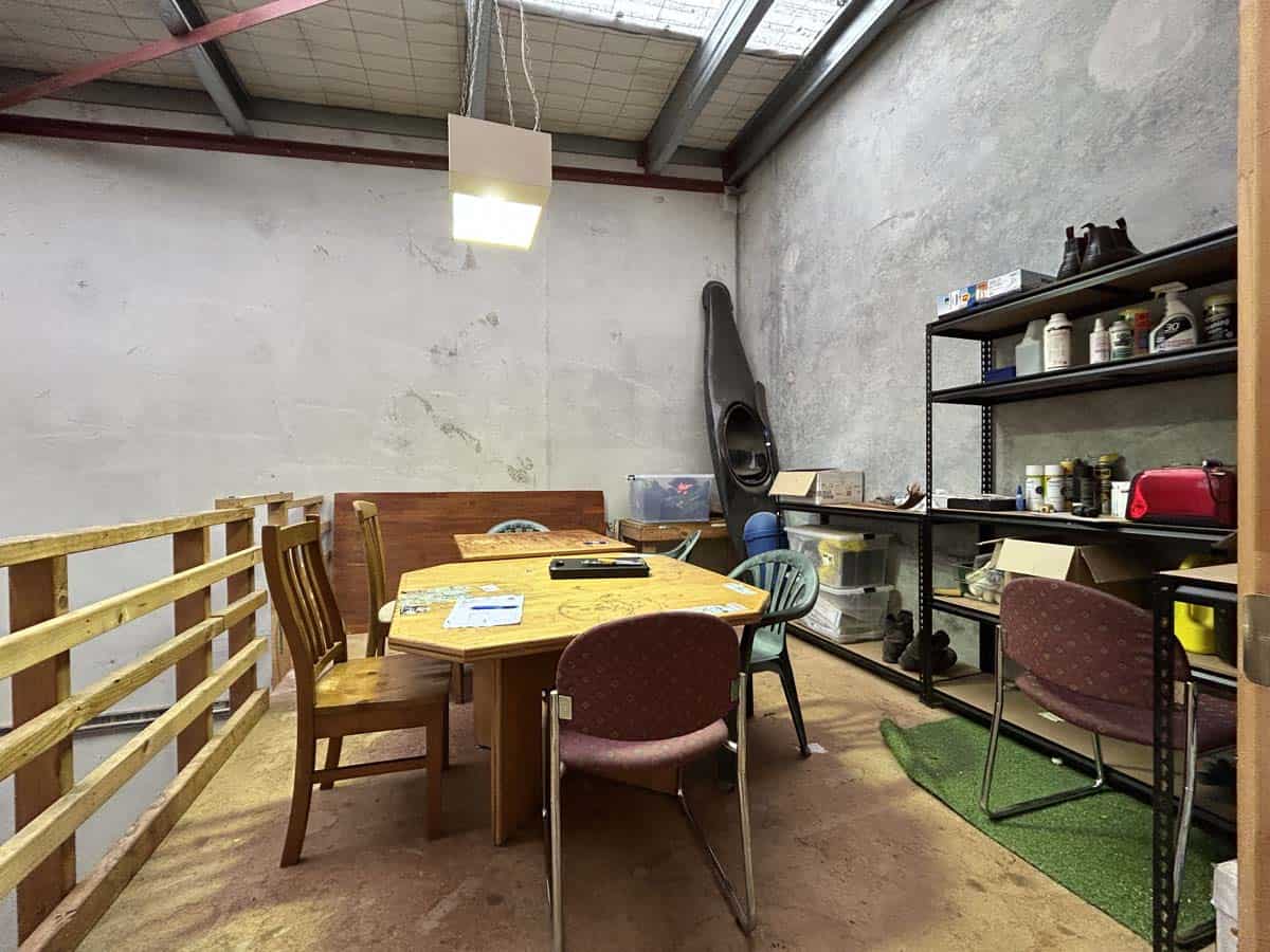 Interior of White Lion workshop with table and chairs for meetings.