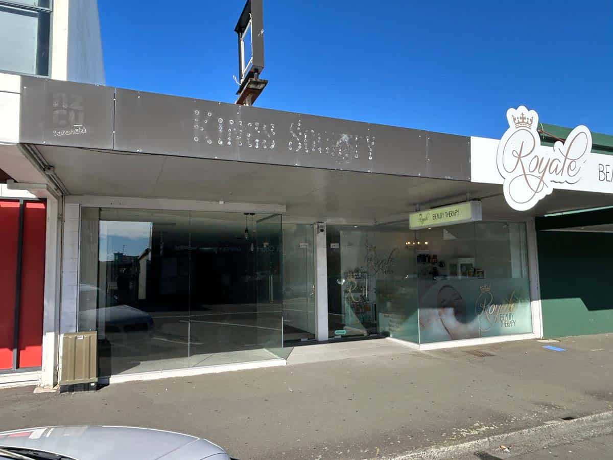 Modern White Lion storefront with glass windows and signage in New Zealand.