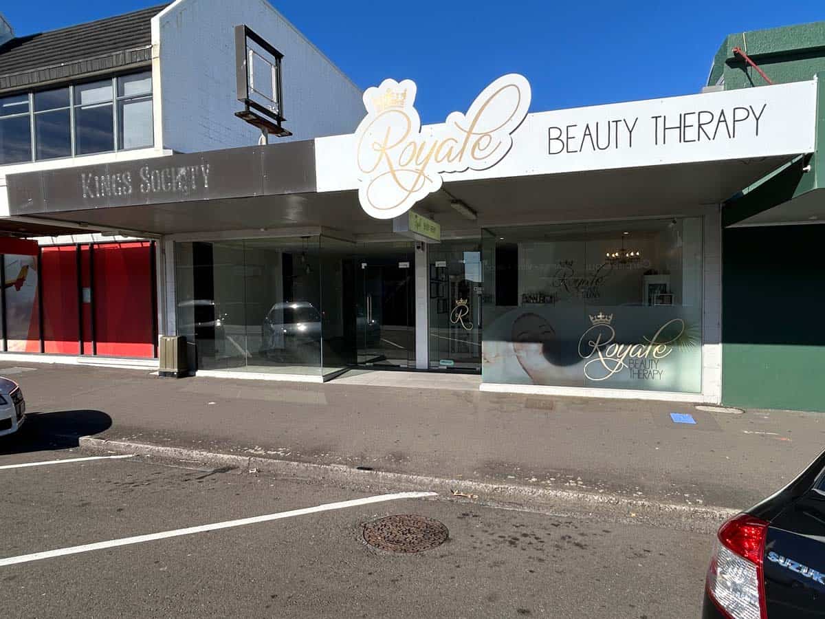 Exterior view of White Lion Beauty Therapy clinic on a sunny day in New Zealand.