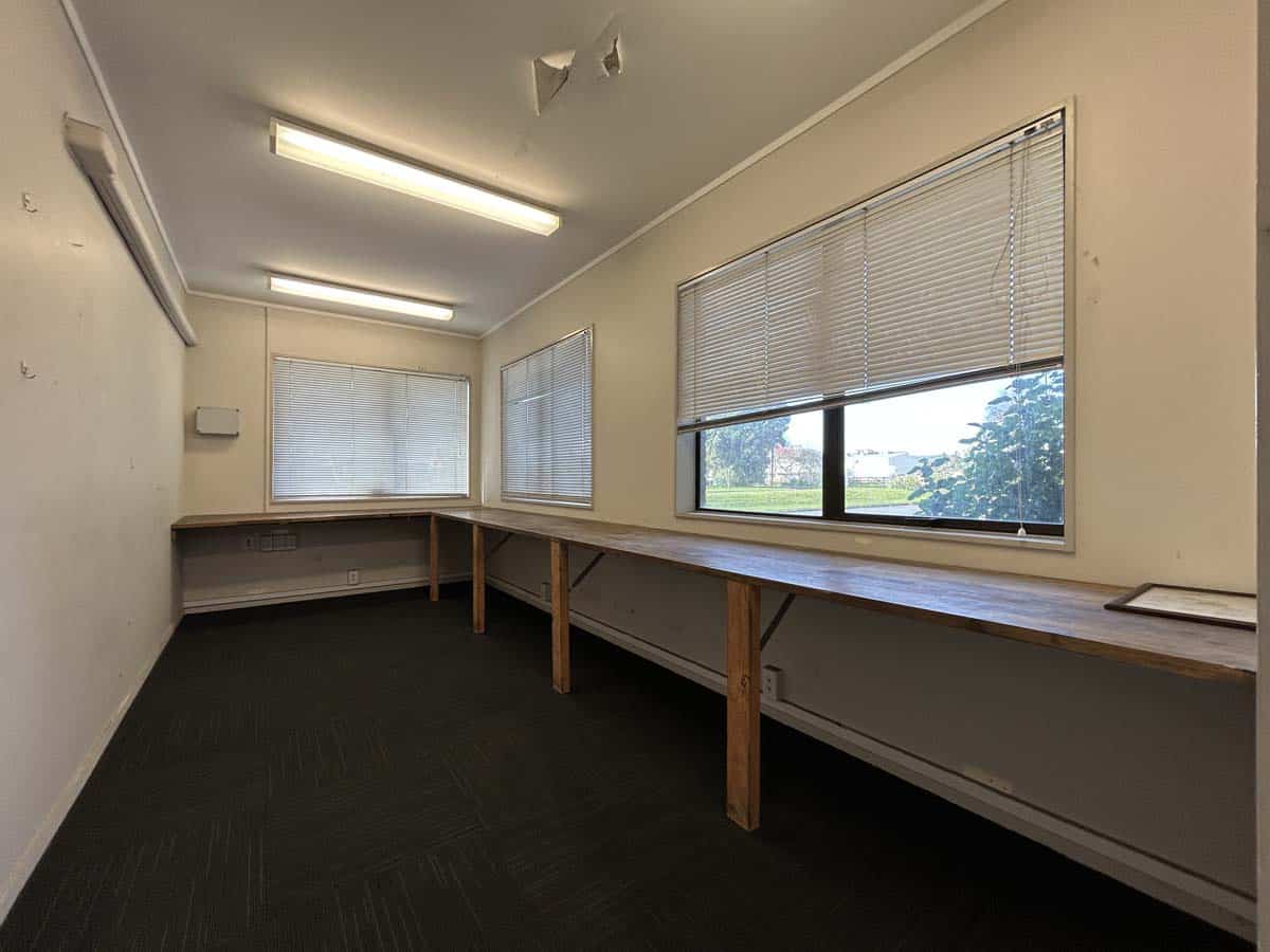 Interior of White Lion office with large windows, workbenches, and natural light.