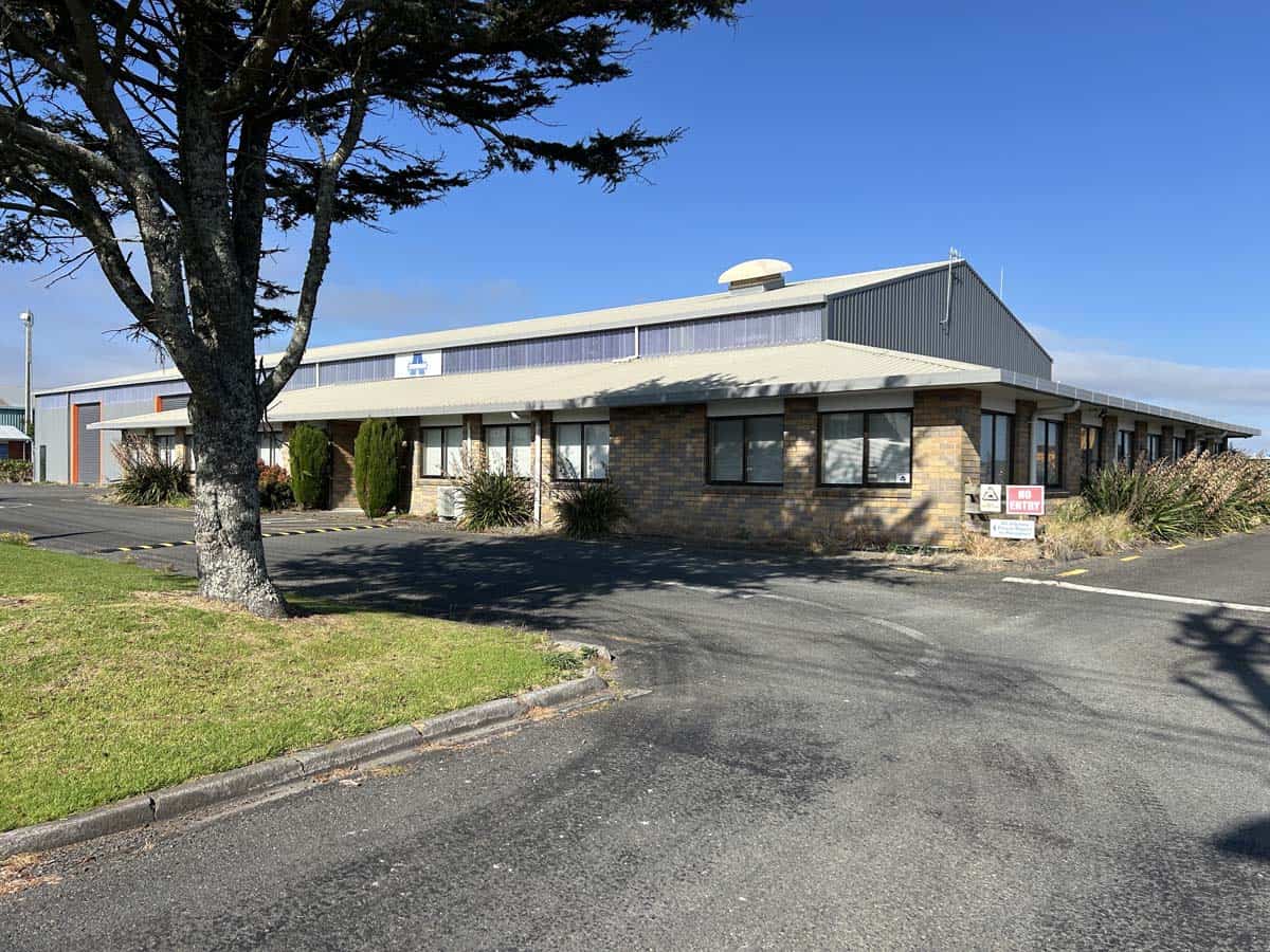 Modern White Lion office building with landscaped surroundings in New Zealand.