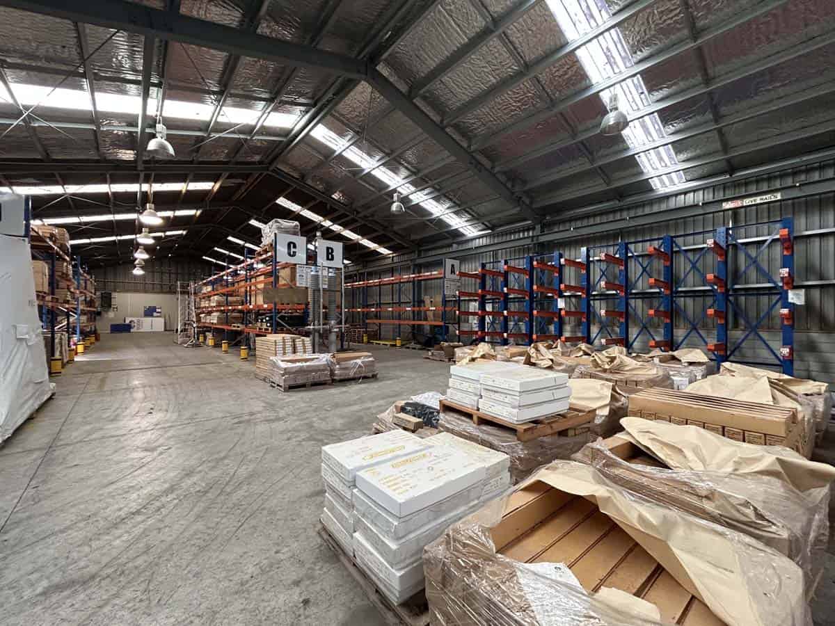 Interior of White Lion warehouse showing storage racks and supplies.