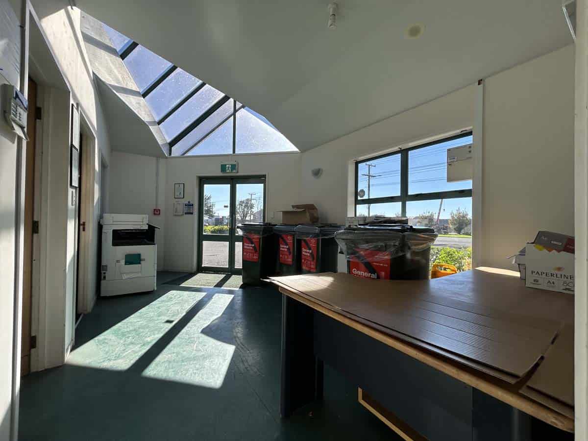 Bright office space with large windows and natural light.