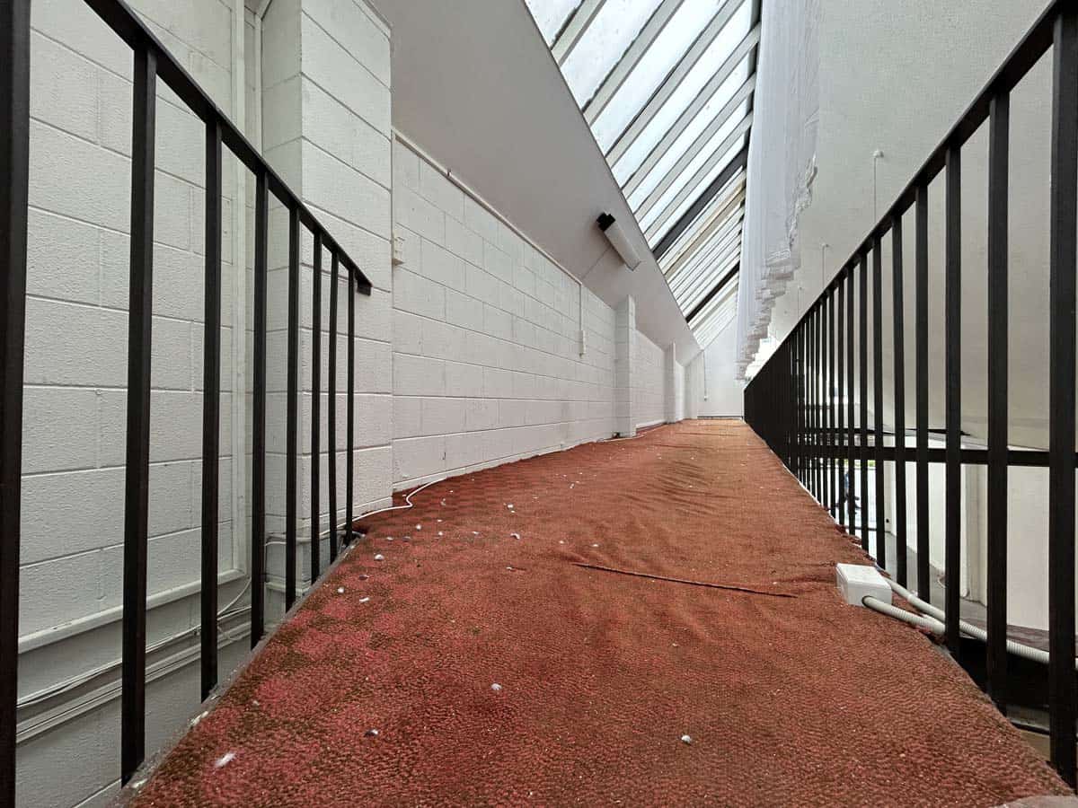Interior corridor with skylight and railing at White Lion building.