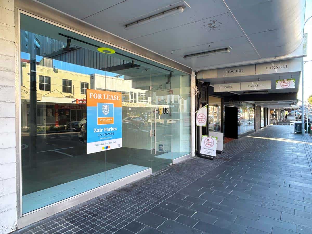 Commercial retail space available for lease in a busy city street storefront.