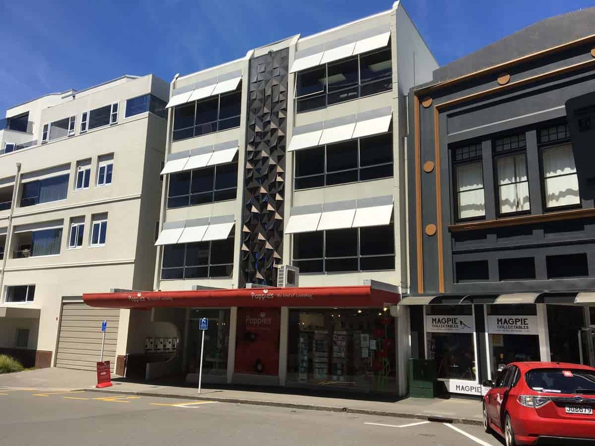 Modern White Lion office building with unique facade in Auckland city center.
