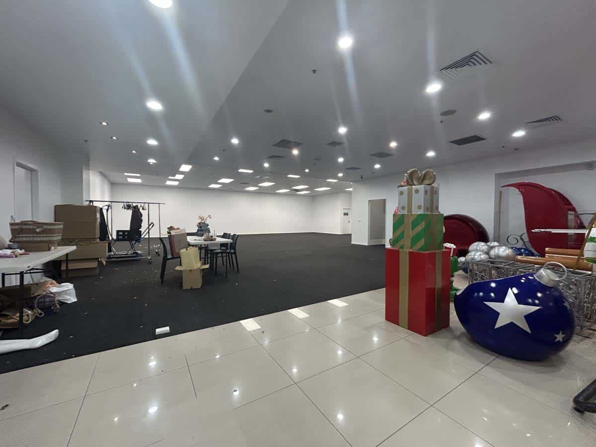 Spacious White Lion event venue decorated for Christmas with gifts and festive decor.