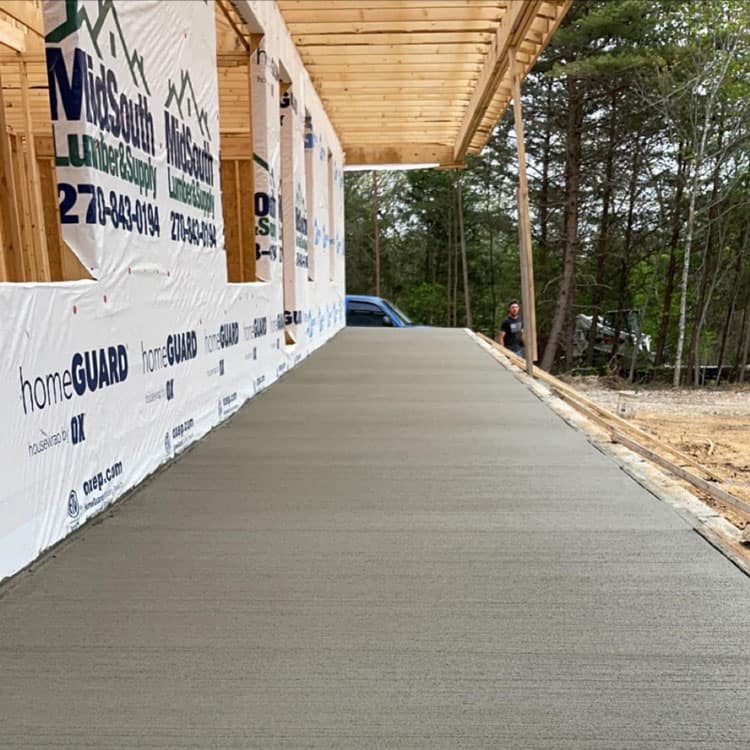 Concrete porch construction at a residential property in Kentucky.