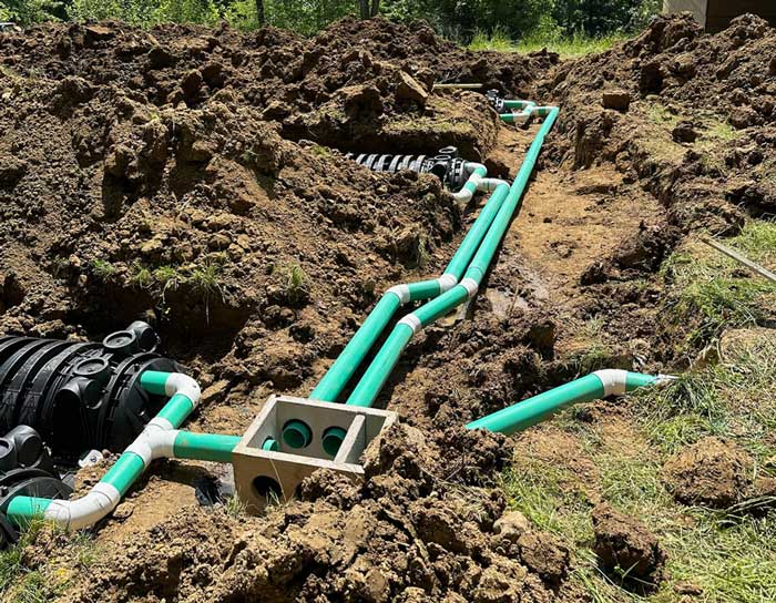 Drainage pipe installation in a construction site for proper water management.