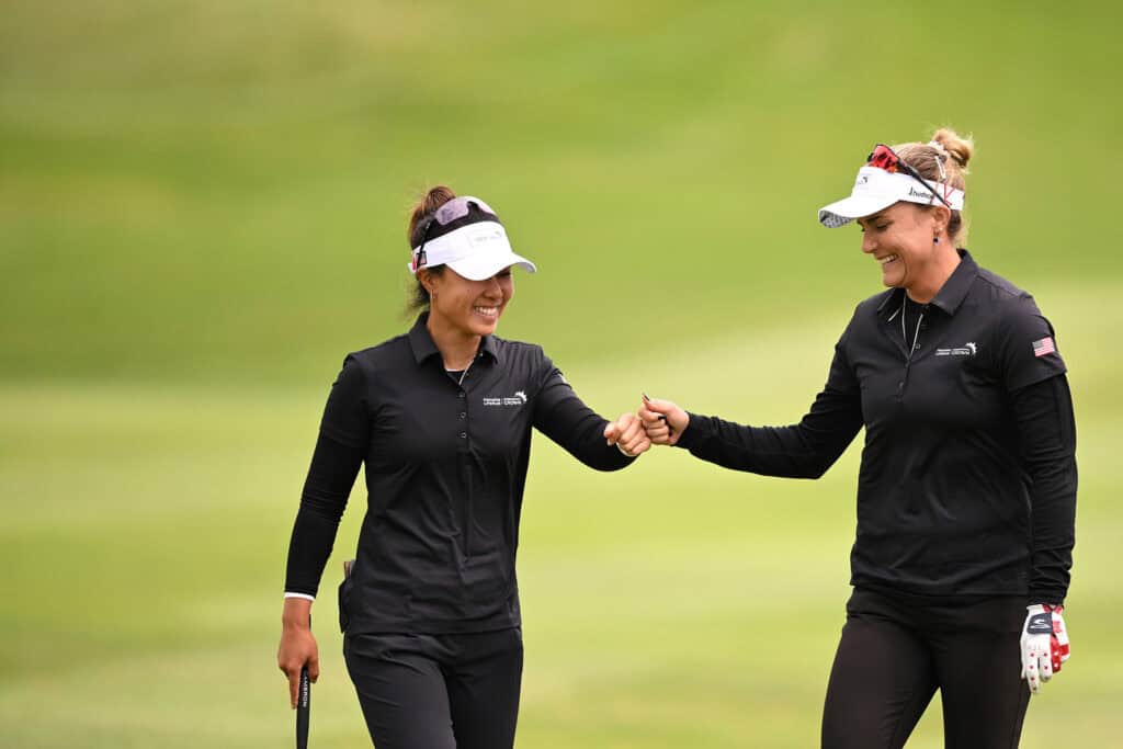 SAN FRANCISCO, CALIFORNIA - MAY 04: Danielle Kang (L) and Lexi Thompson (R) of Team United States fist bump after a shot on the tenth hole during day one of the Hanwha LIFEPLUS International Crown at TPC Harding Park on May 04, 2023 in San Francisco, California. (Photo by Orlando Ramirez/Getty Images)