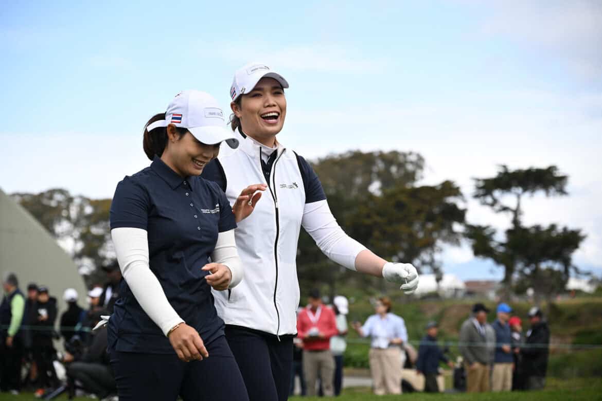 SAN FRANCISCO, CALIFORNIA - MAY 04: Moriya Jutanugarn (L) and Ariya Jutanugarn (R) of Team Thailand walk off the first tee during day one of the Hanwha LIFEPLUS International Crown at TPC Harding Park on May 04, 2023 in San Francisco, California. (Photo by Orlando Ramirez/Getty Images)