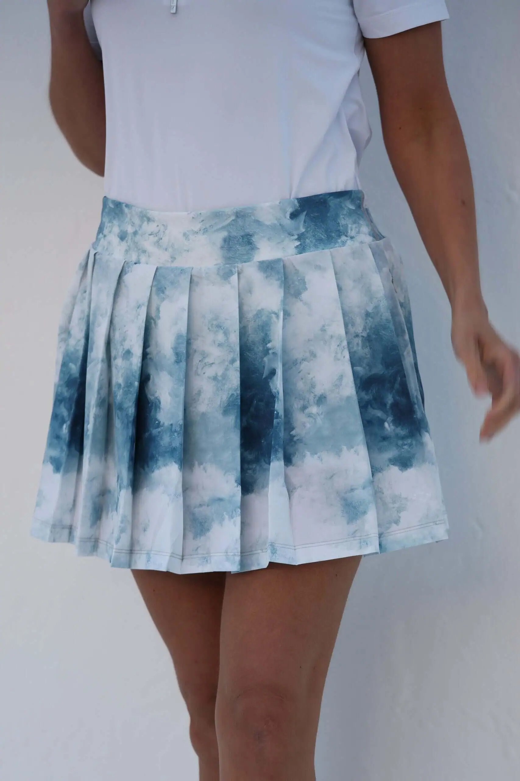 famara-golf-box-pleat-skort-clouds-1
