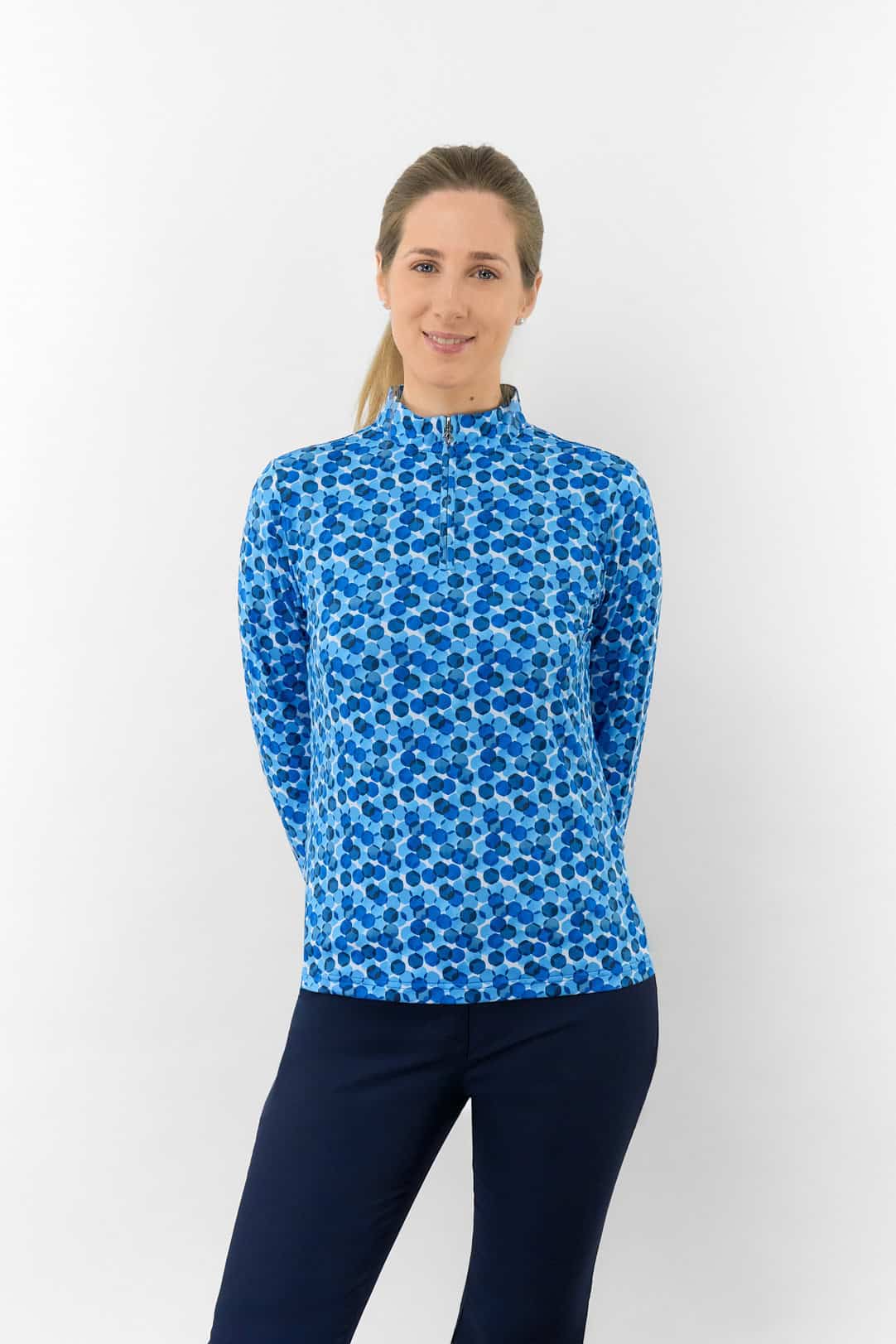 pure-golf-serenity-long-sleeve-ladies-golf-zip-top-blueberry-bokeh-1-1