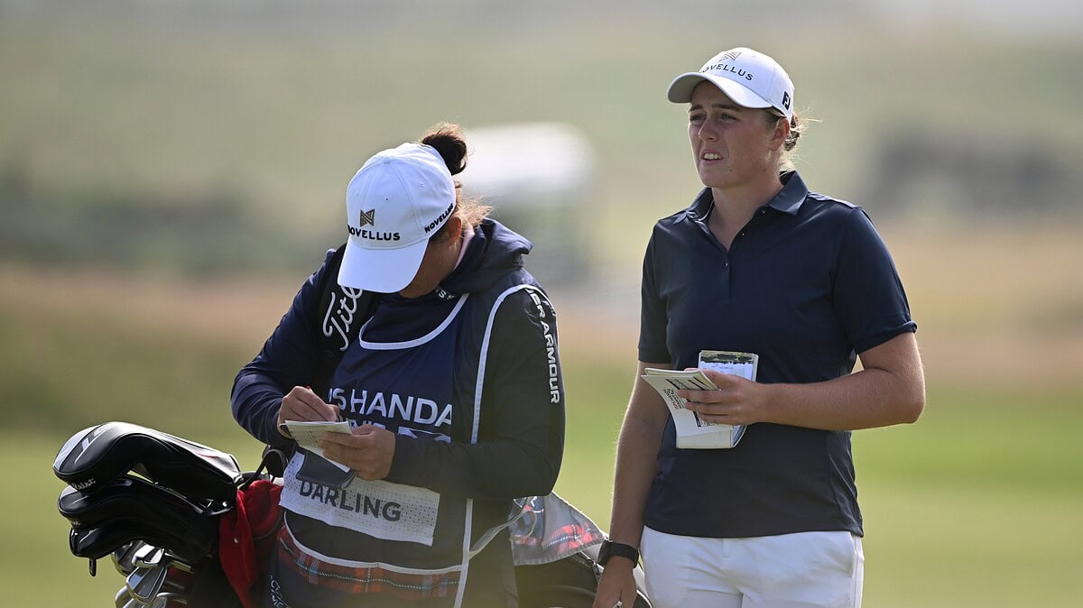 Hannah Darling with a caddie on a golf course