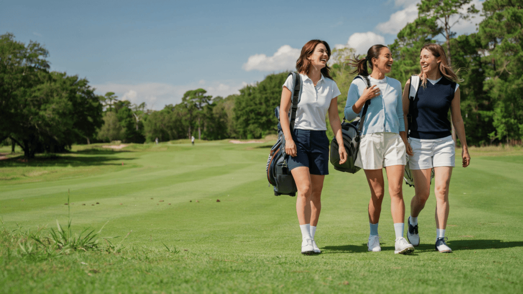 Three women golfer walking on a golf course