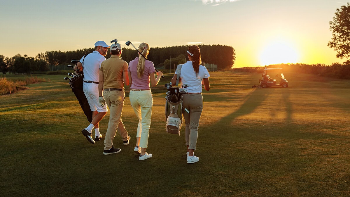 group of women golfers playing golf in the twilight
