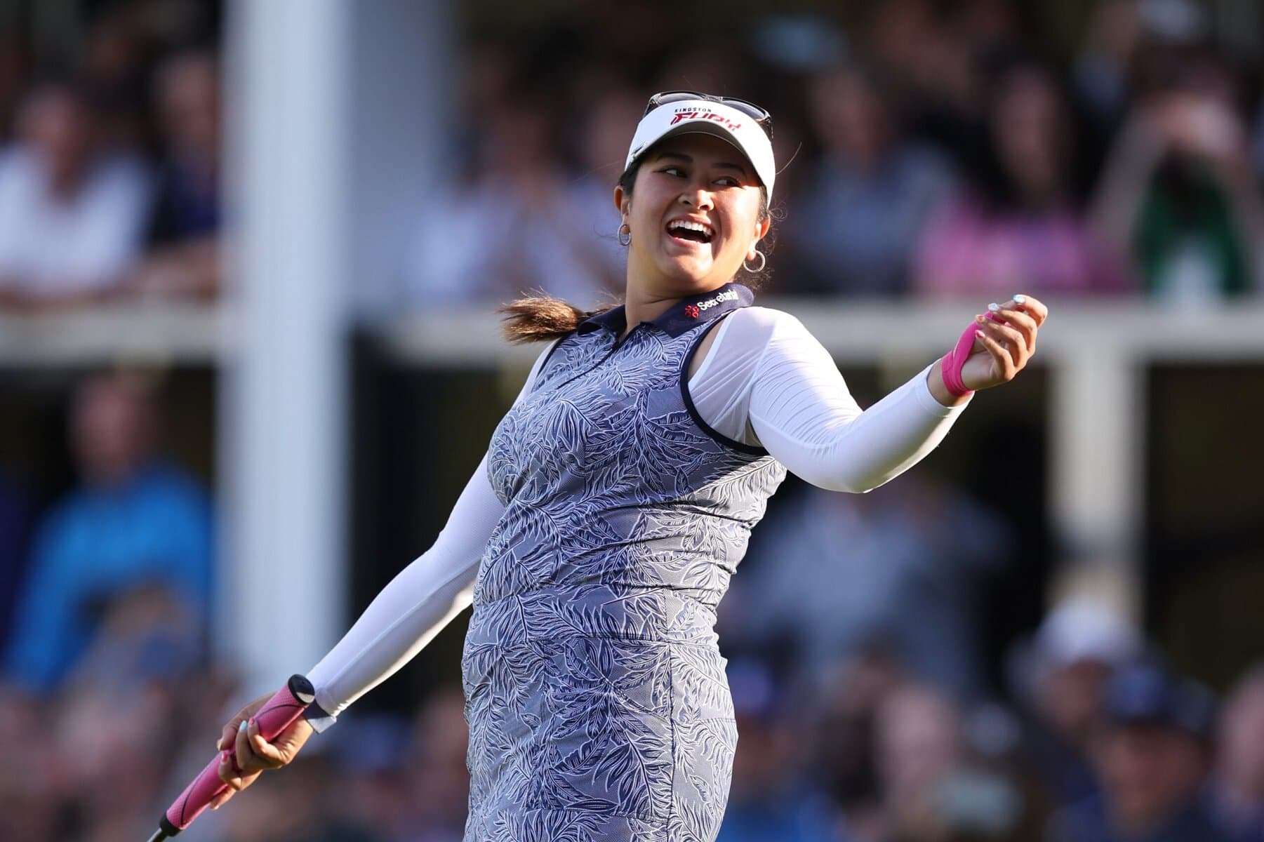 Liia Vu celehrating victory on a golf course