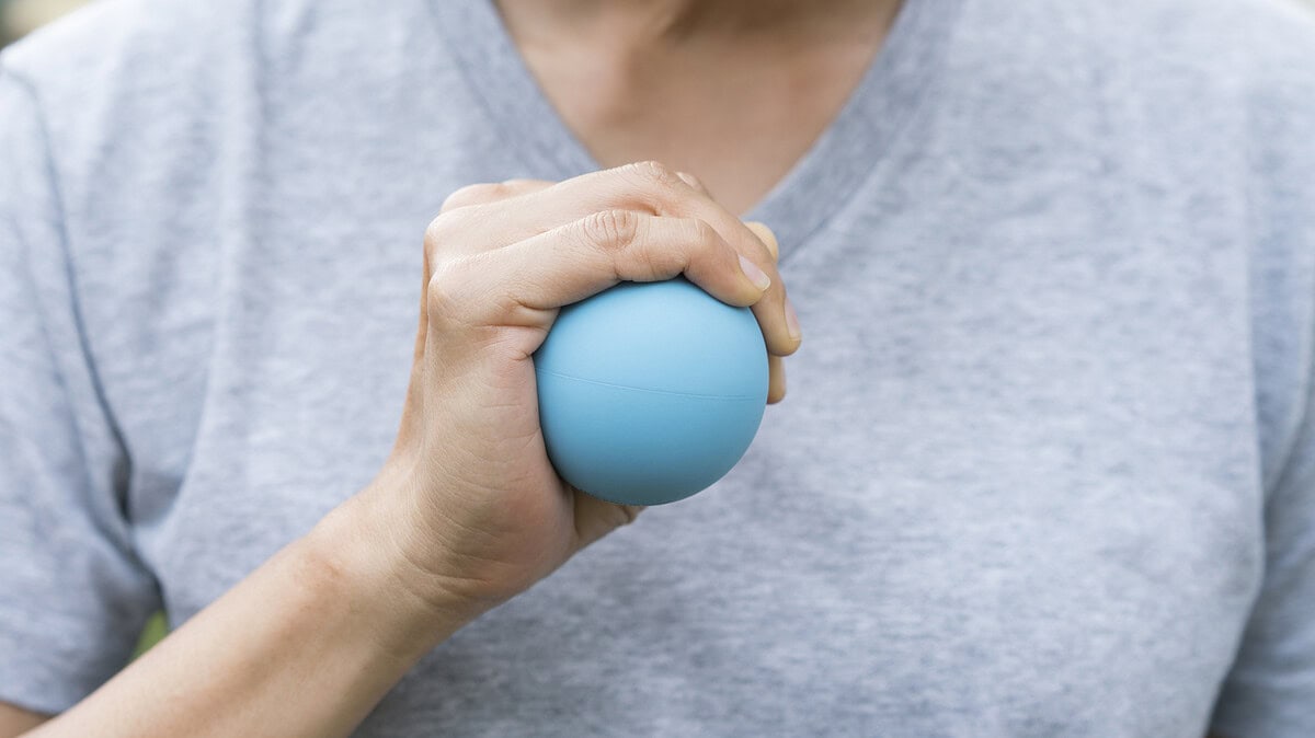 Lady squeezing a stress ball