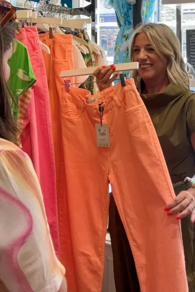 Angie Huddart with a customer at her Doncaster boutique, where helping women find the right fit has been the day job since 2019.
