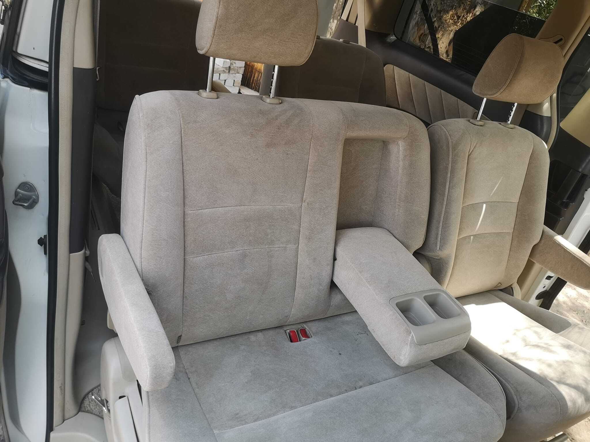 The interior of a car with the driver's seat up.