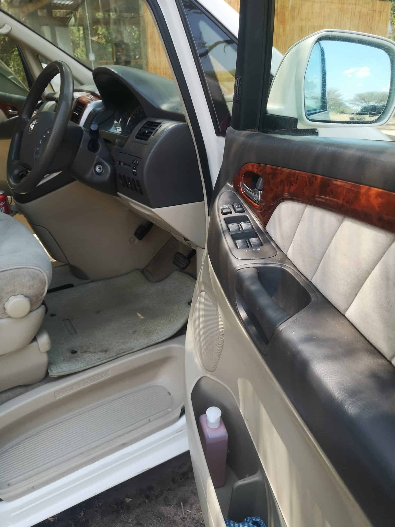 The interior of a car with a leather seat.