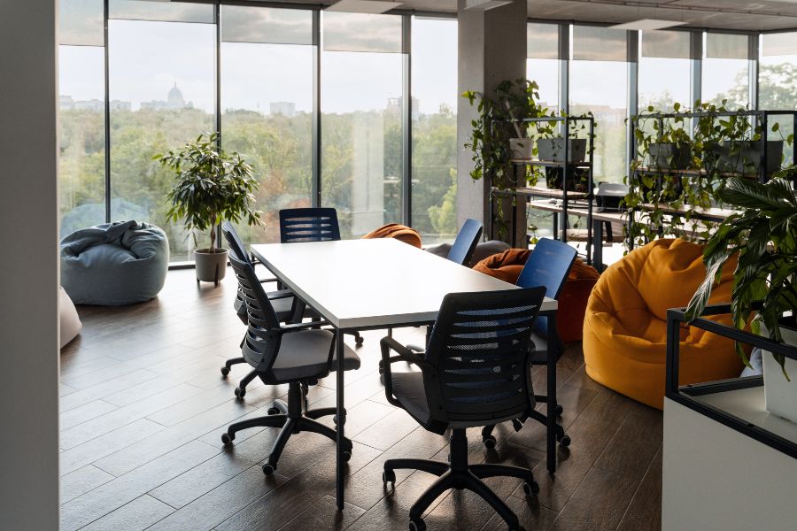 Modern coworking office with panoramic city views and flexible seating.