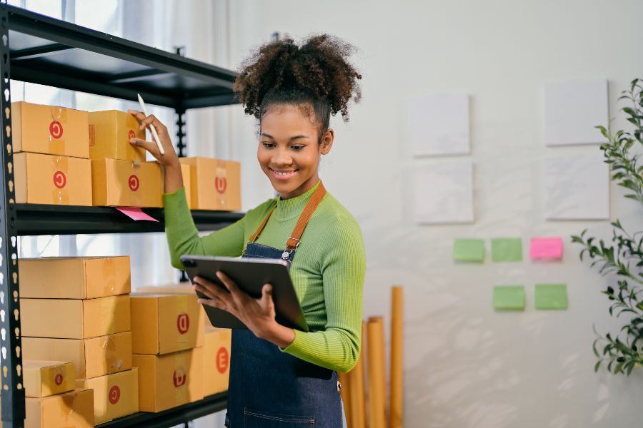 A woman managing inventory in a small business workplace.