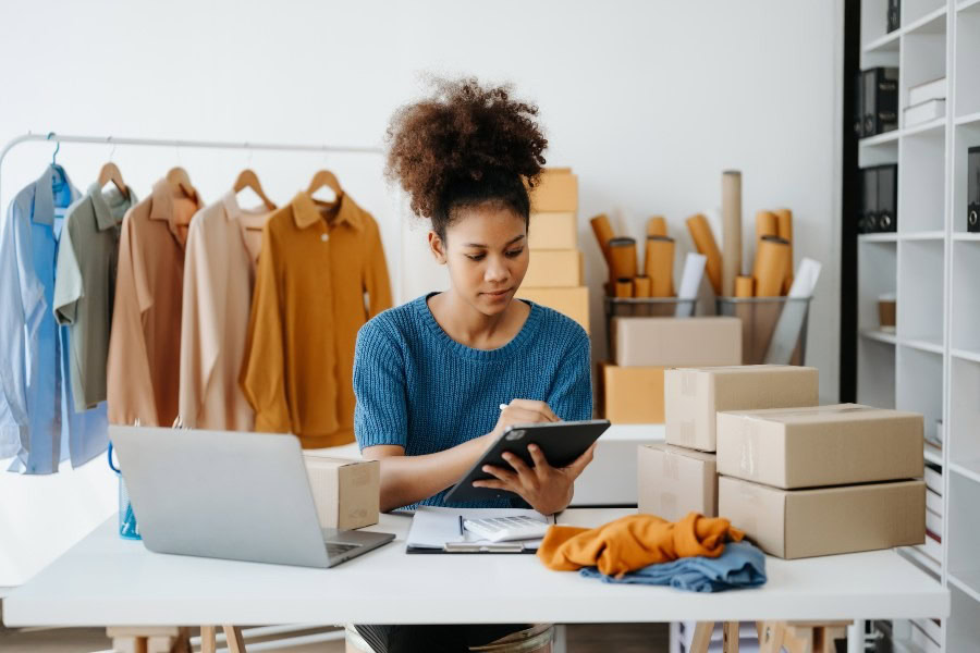 Online clothing retailer managing packaged orders with inventory management for ecommerce tools