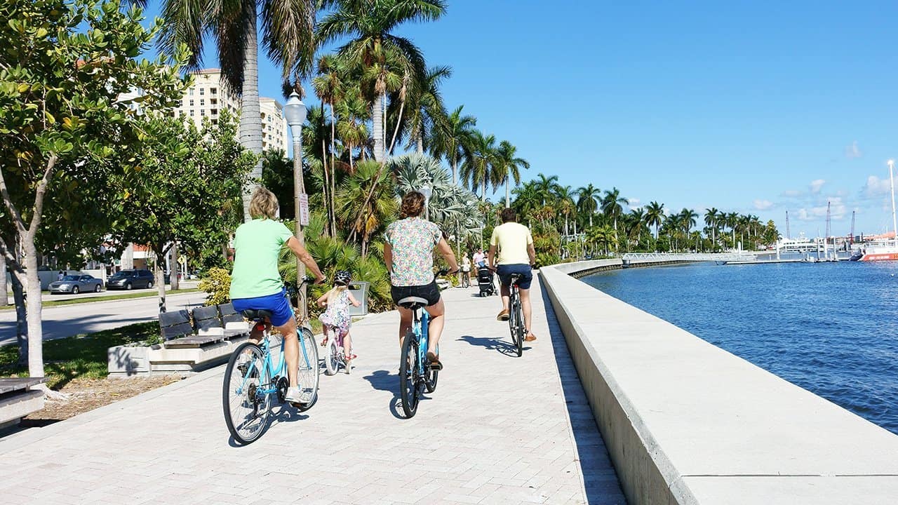 Family riding bikes in West Palm Beach, Florida