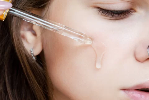 large-main_woman_uses_serum_for_face.jpg