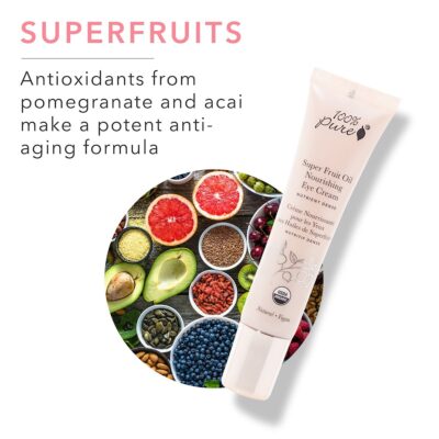Vibrant superfruits including pomegranate, acai, blueberries, and kiwi surrounding a tube of 100% Pure Super Fruit Oil Nourishing Eye Cream, emphasizing natural, antioxidant-rich skincare.