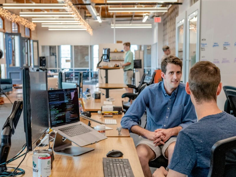 A team working together in a large open plan office