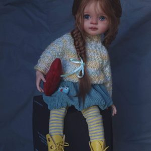 a doll sitting on a box