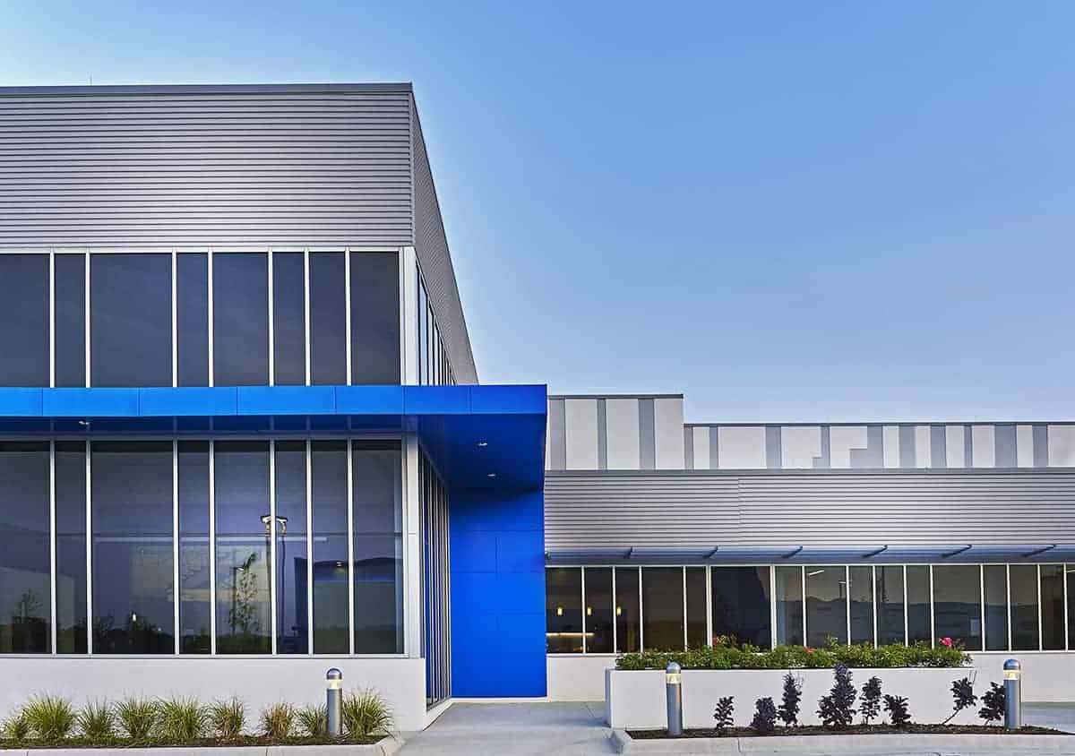 Modern industrial building with blue accents.