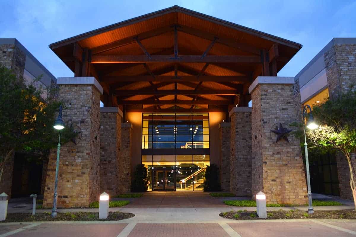 Illuminated modern building entrance at dusk