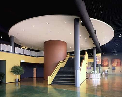 Modern lobby with circular stairway and artwork