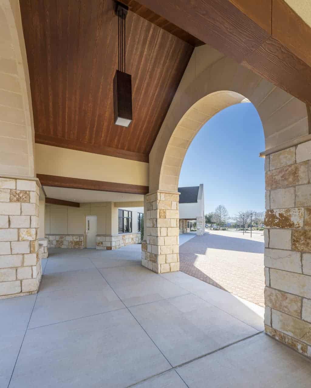 Stone archway with modern wooden ceiling