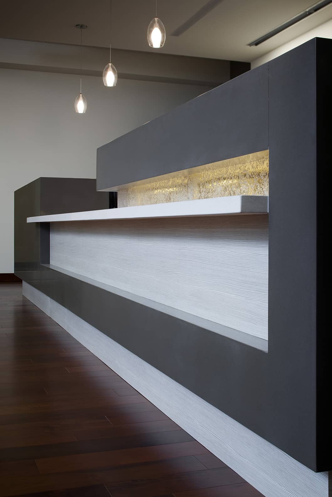 Modern minimalist reception desk with geometric design.