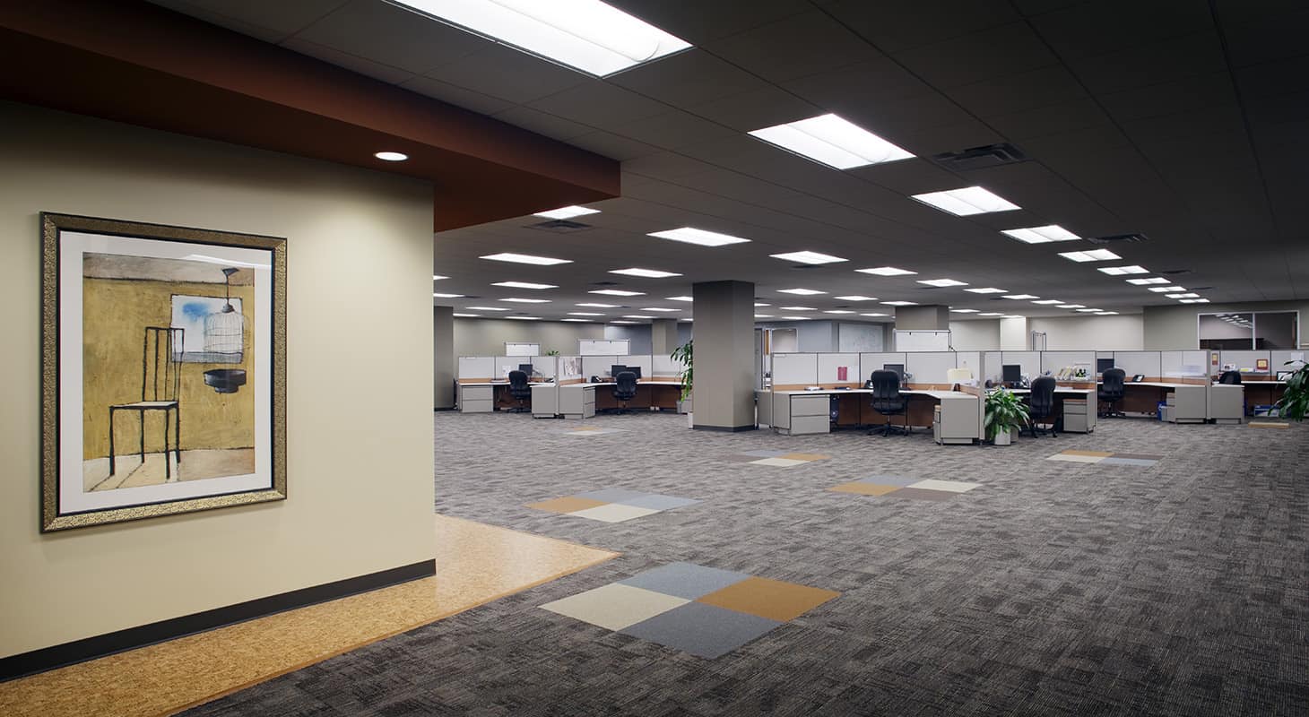 Spacious modern office with cubicles and artwork