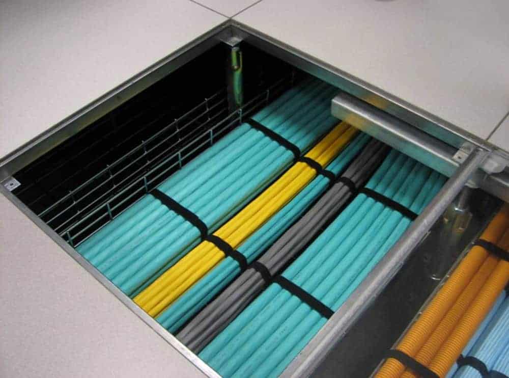 Color-coded network cables visible in server rack for data infrastructure.