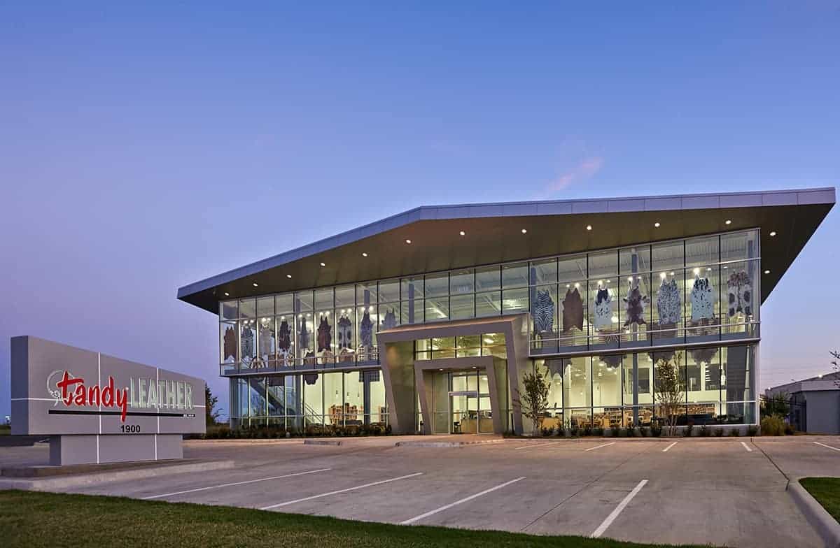 Modern building with glass facade at dusk.