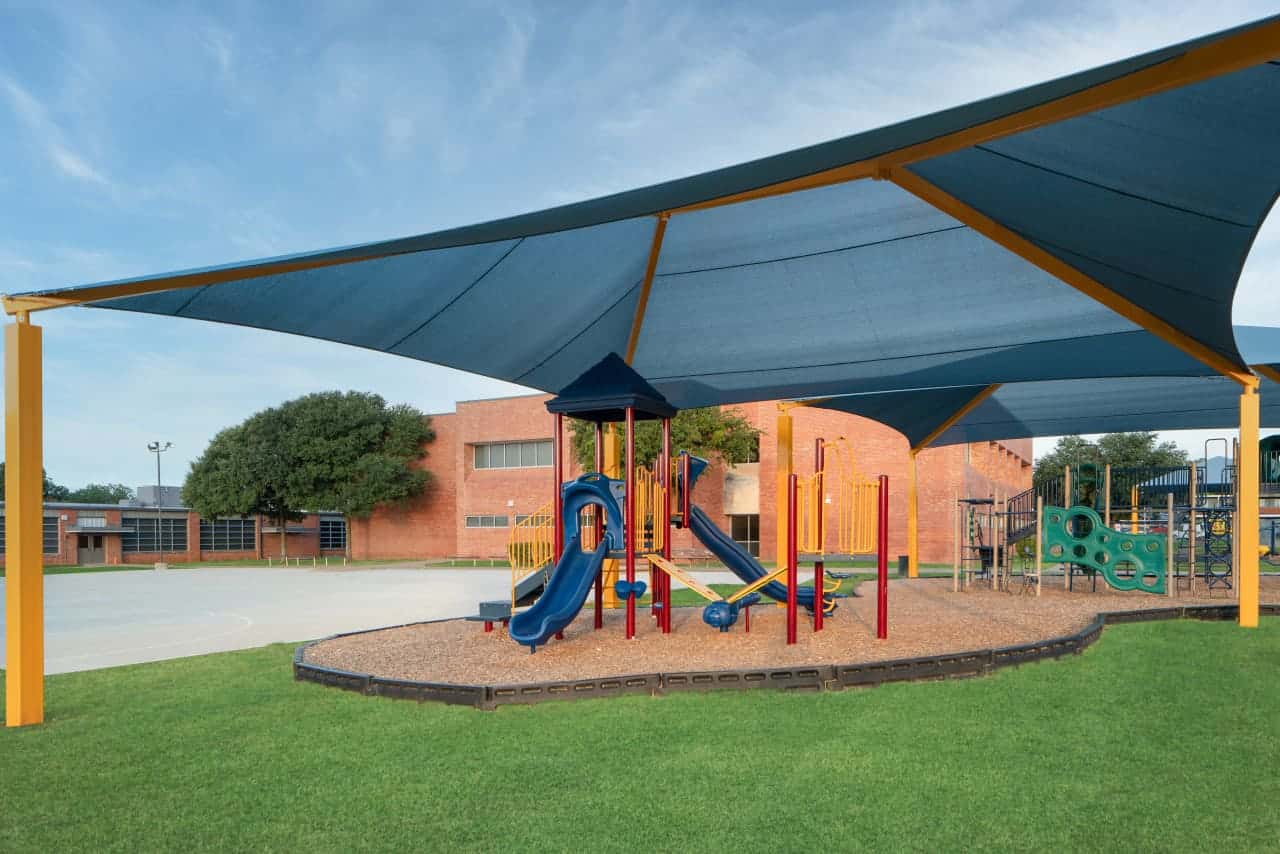 Playground with shade canopy at school.