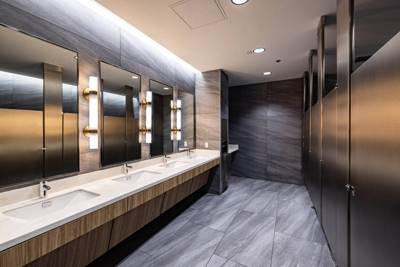 Modern restroom with sinks and stalls