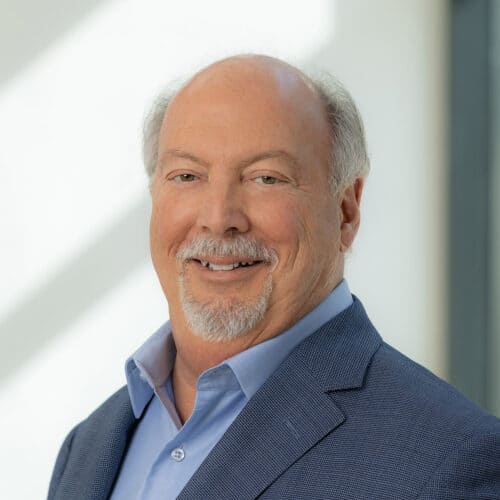 Smiling man in blue blazer and shirt