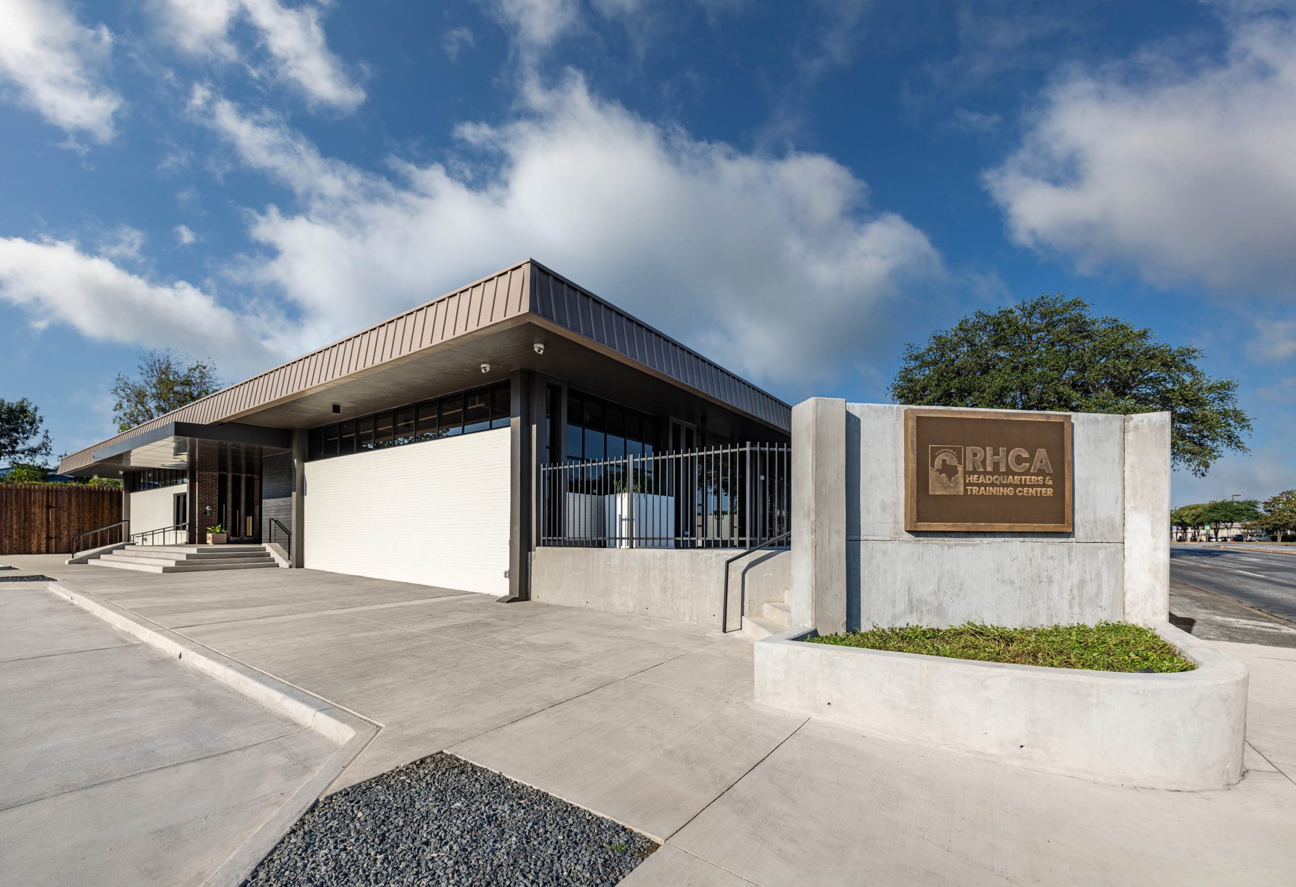 Modern building with RHCA sign outside.
