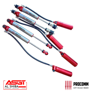 Set of red and silver off-road shock absorbers with braided hoses, branded Procomm, shown diagonally across a white background.
