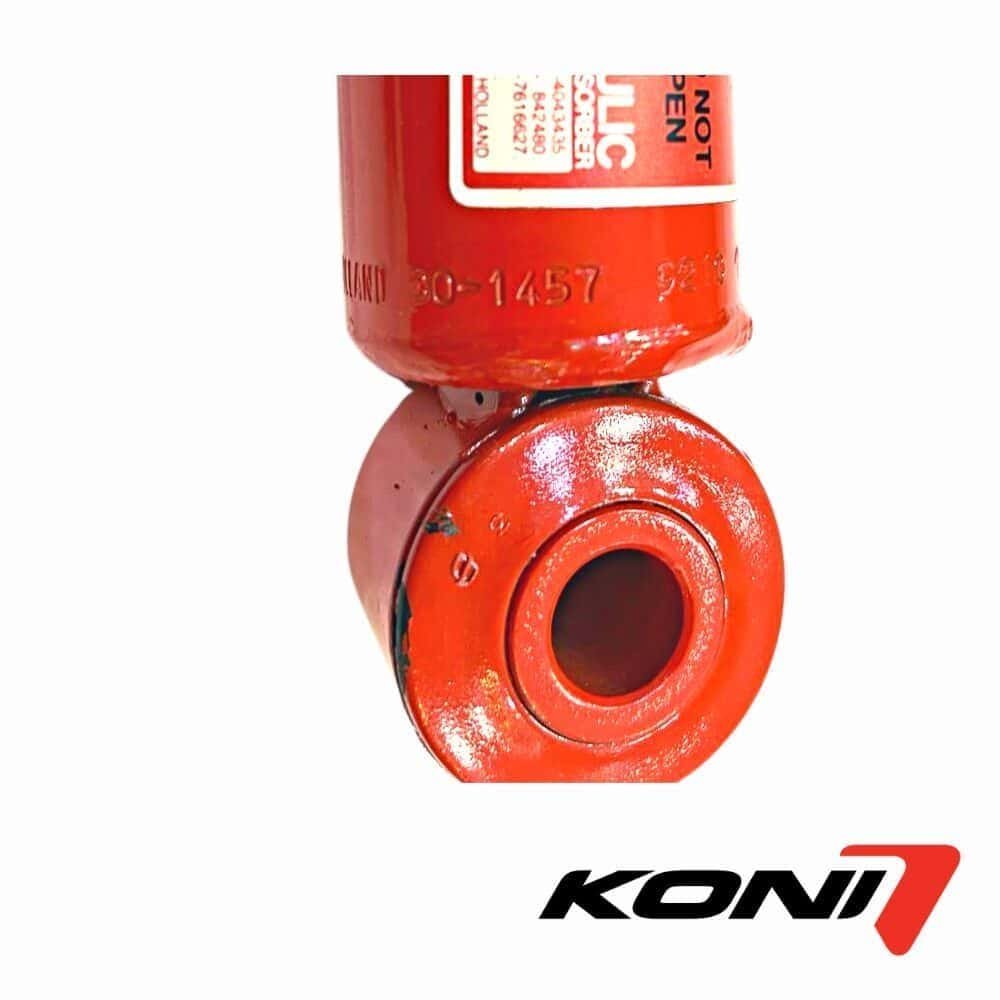 Fire extinguisher valve with safety label, used for fire safety and prevention.