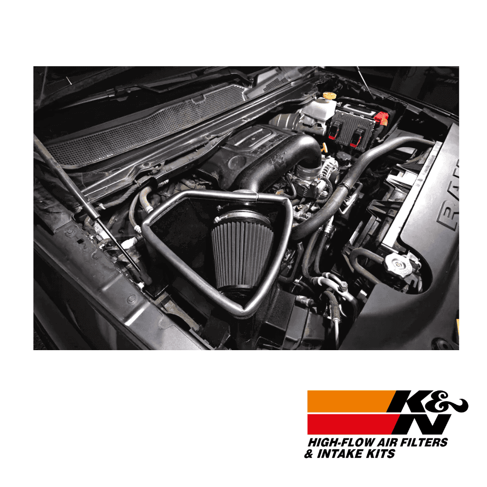 High-flow air filters and intake kits installed in a car engine for improved performance and airflow.